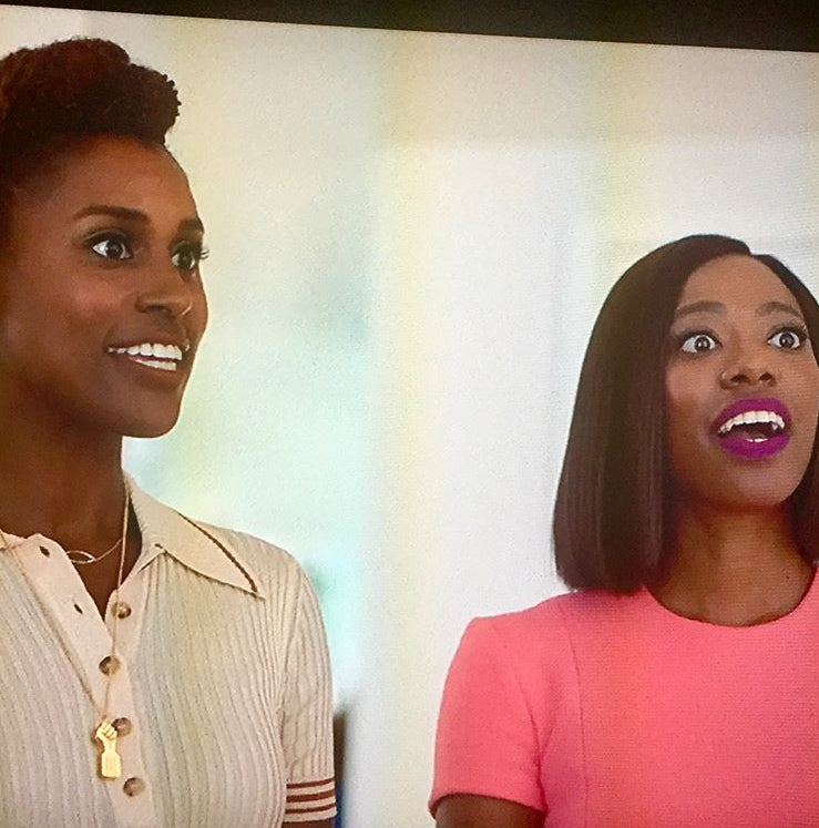 Gold black power fist pendant Clearance